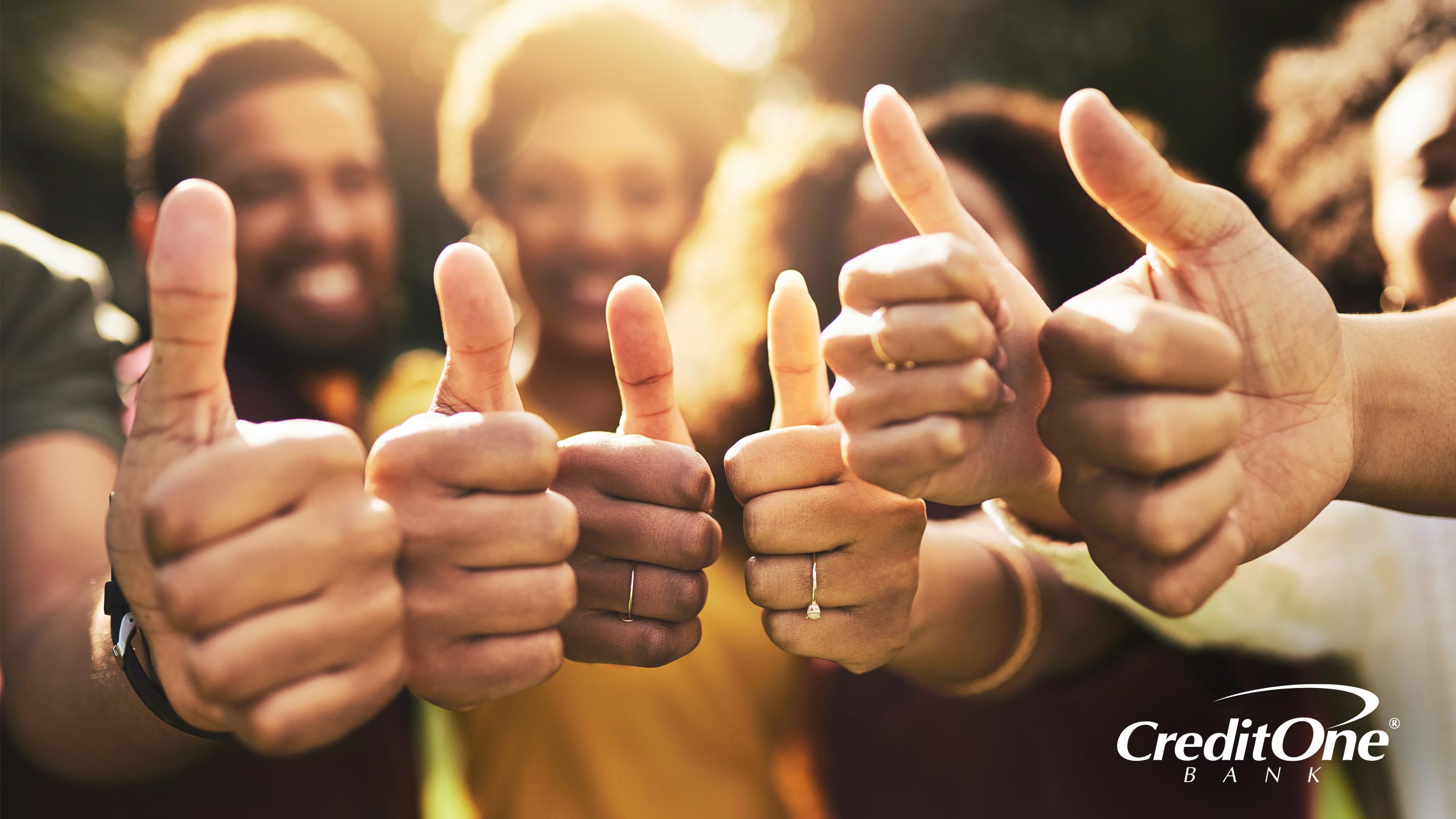A group of friends offer a thumbs up, symbolizing how many lenders offer pre-approval for their credit cards.