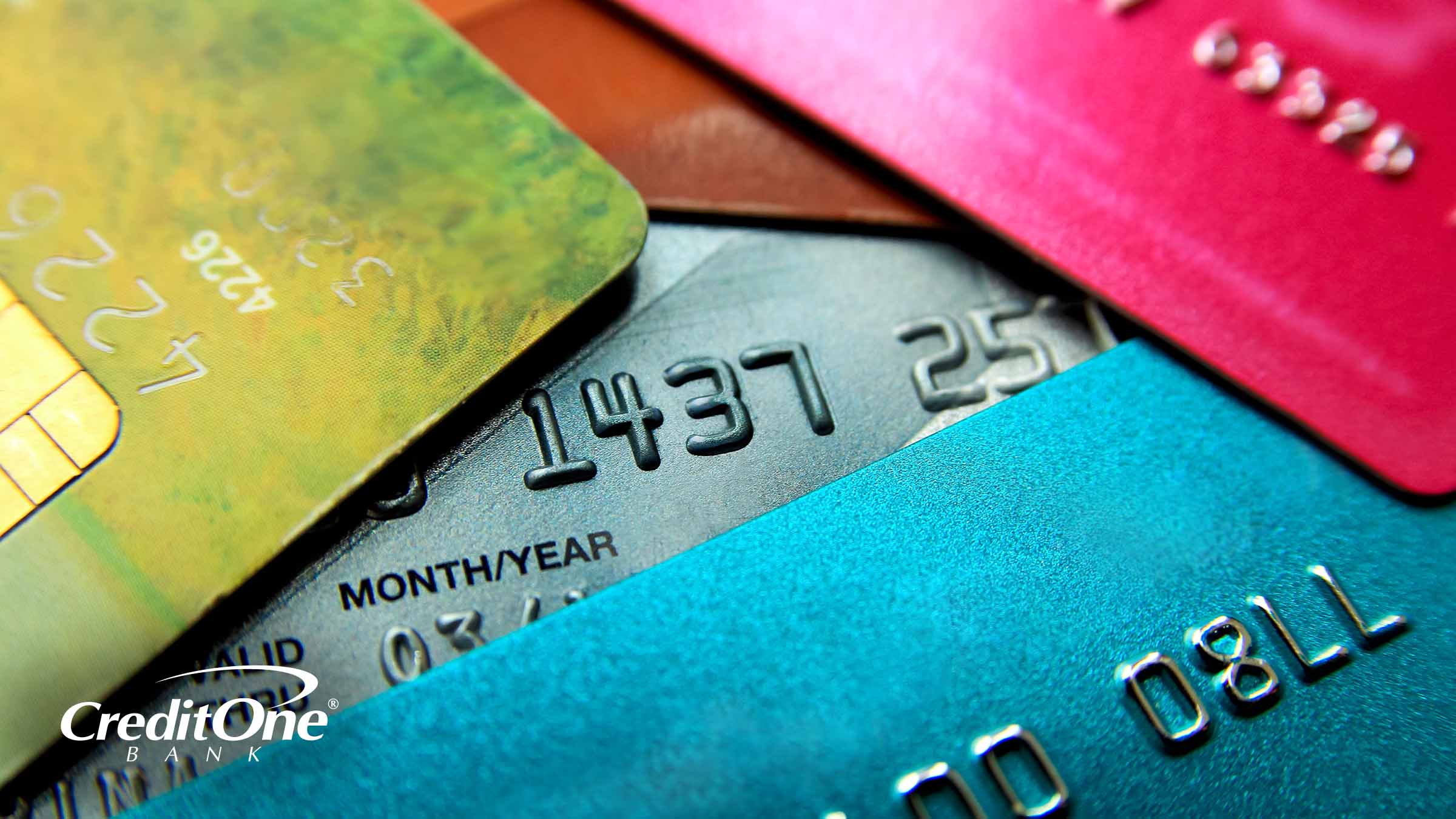 A stack of credit cards is shown close up, representing the concept of using one credit card to pay off another.