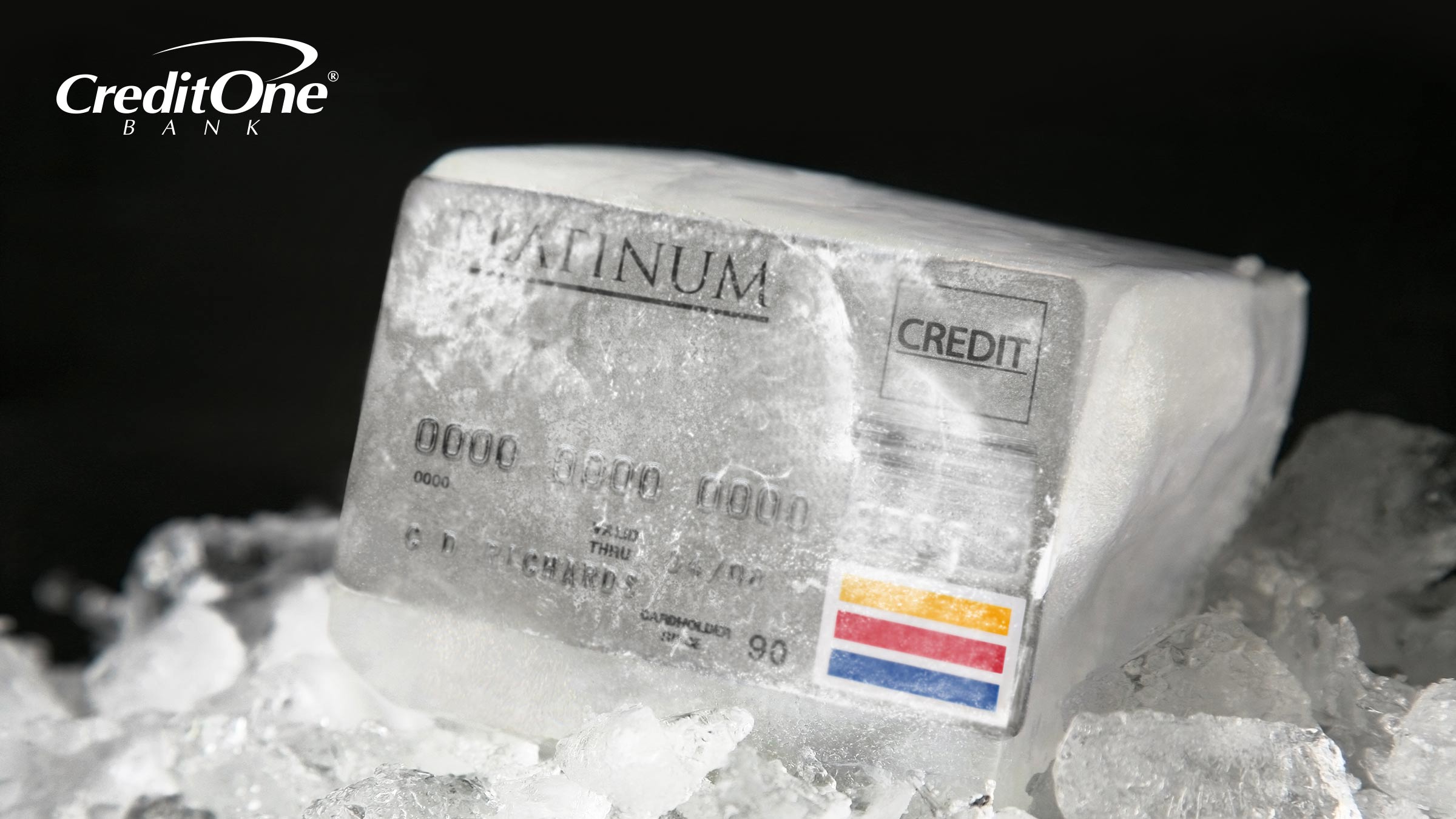 A credit card is frozen in a block of ice, representing the concept of freezing your credit.